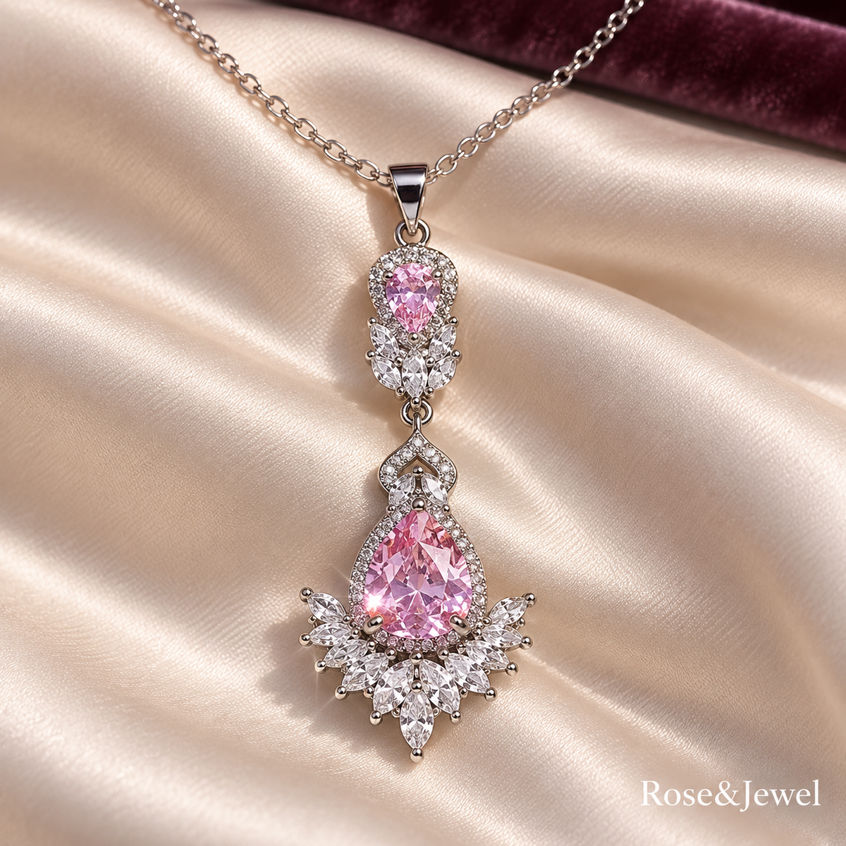 Pink pear pendant with clear marquise accents