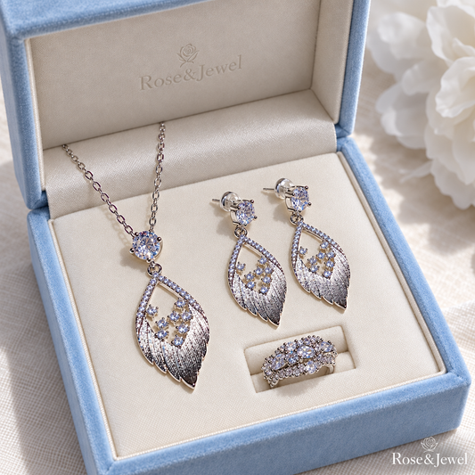 Silver-tone feather jewelry set in a pale blue velvet box