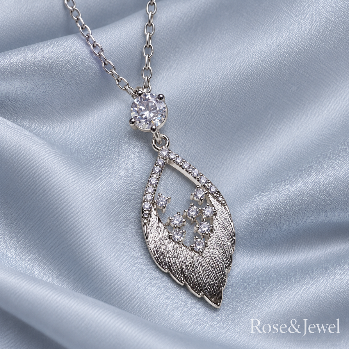 Brushed feather pendant with clear cubic zirconia